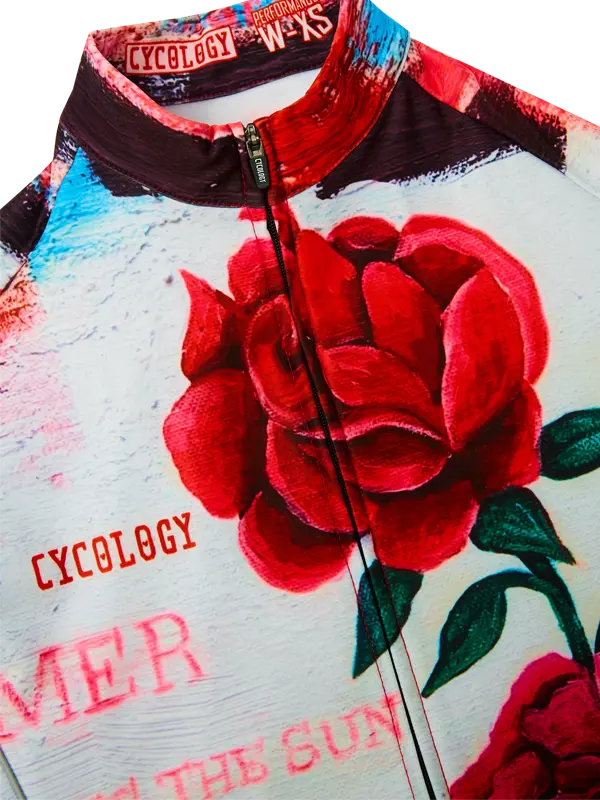 Cycling jersey with red rose design and 'Cycology' branding